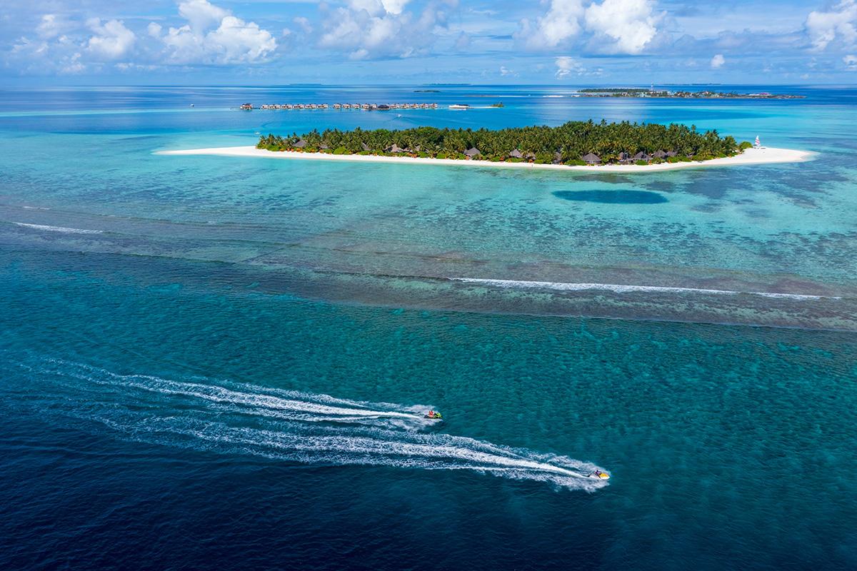 A secluded paradise awaits: Angsana Velavaru Maldives, a breathtaking island resort surrounded by a vast ocean.
