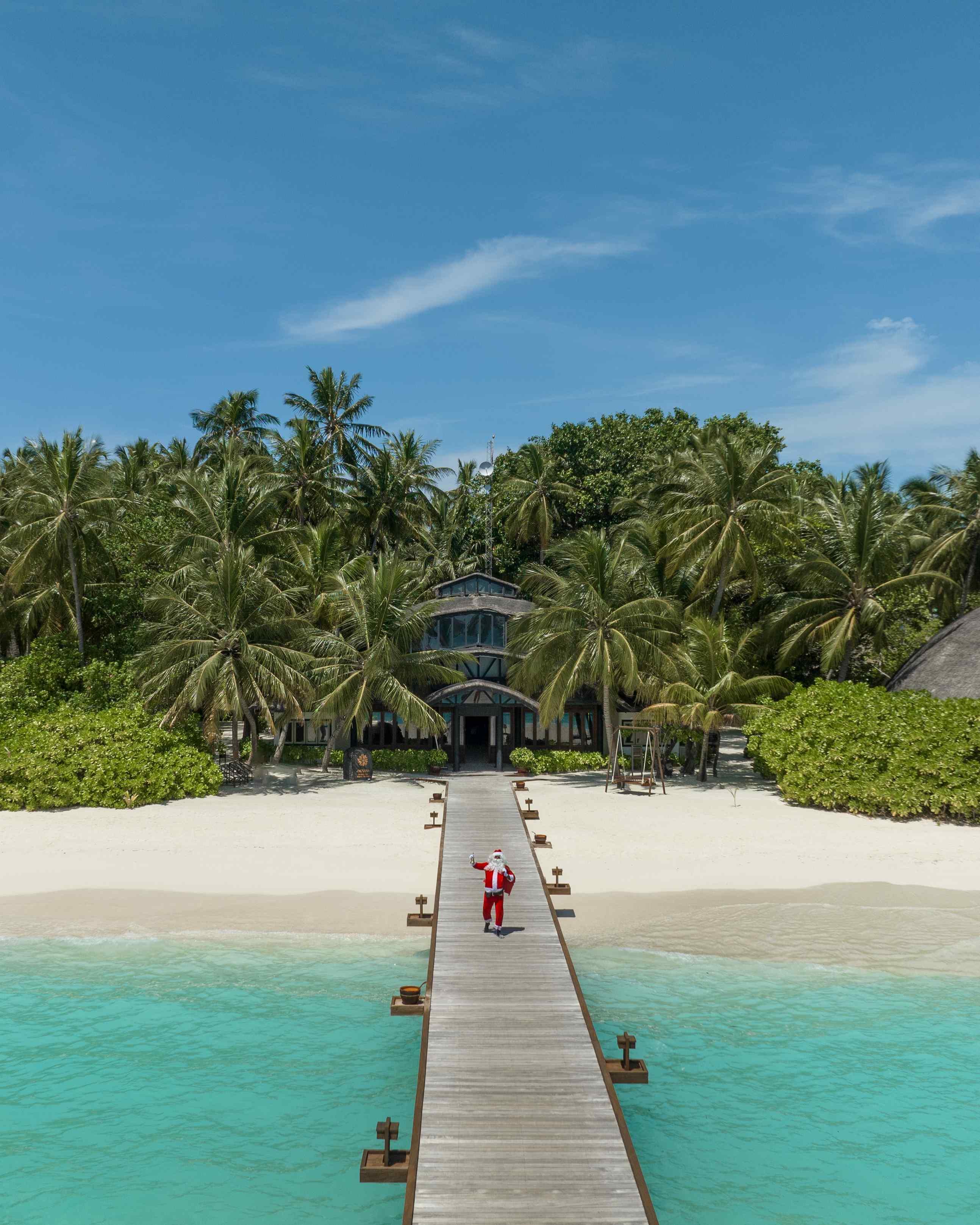 Festive Season at Angsana Velavaru, Santa standing on the arrival jetty 