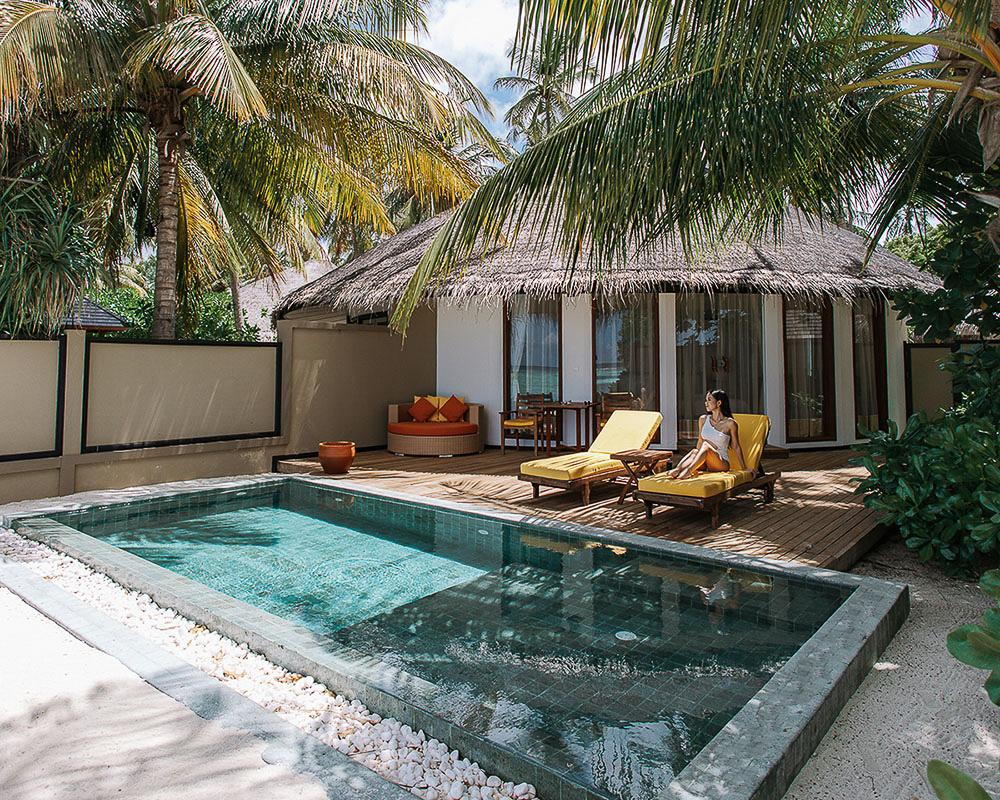 Relaxation Redefined: Woman Sunbathing on Private Sunbed at Angsana Velavaru Maldives 