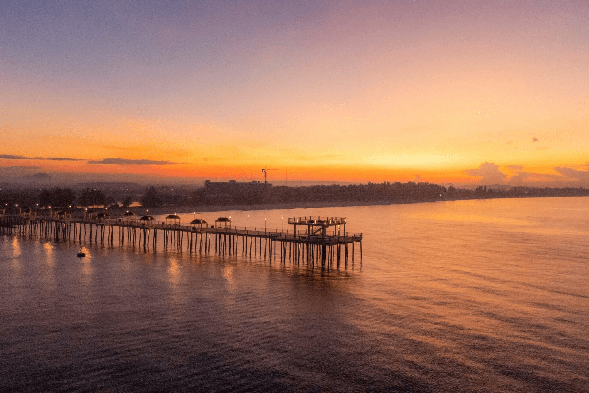 Seaside pier at sunset.