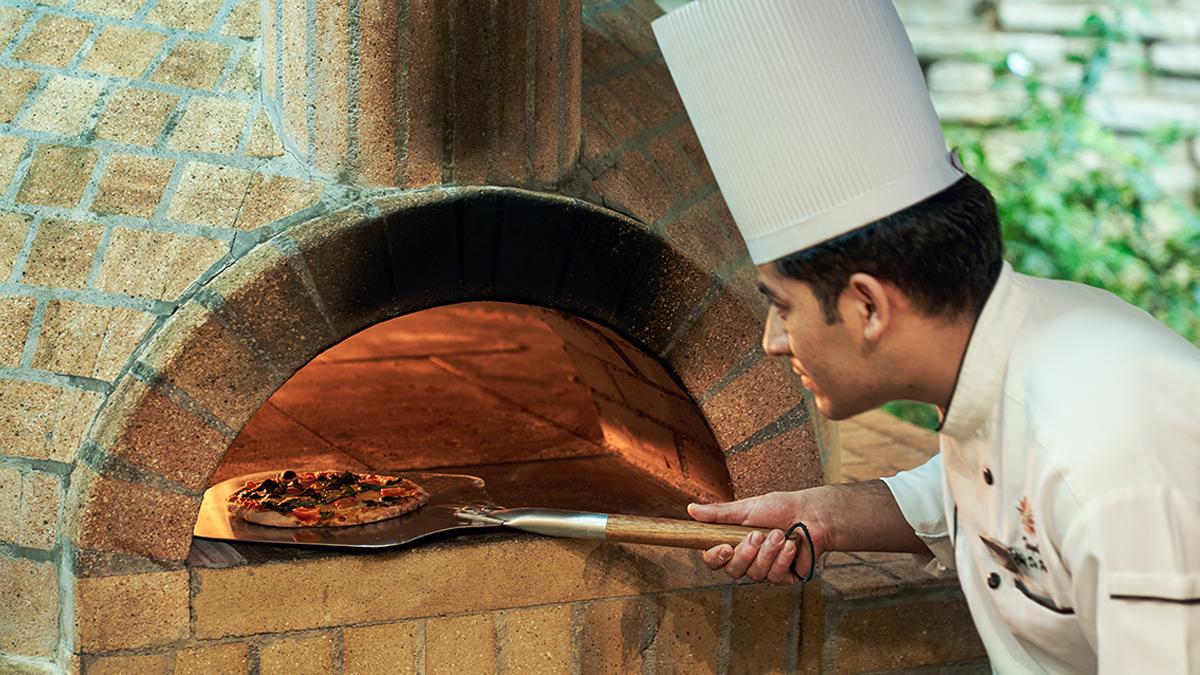 Chief Preparing Pizza in Sundance Bistro at Angsana Resort Bangalore0
