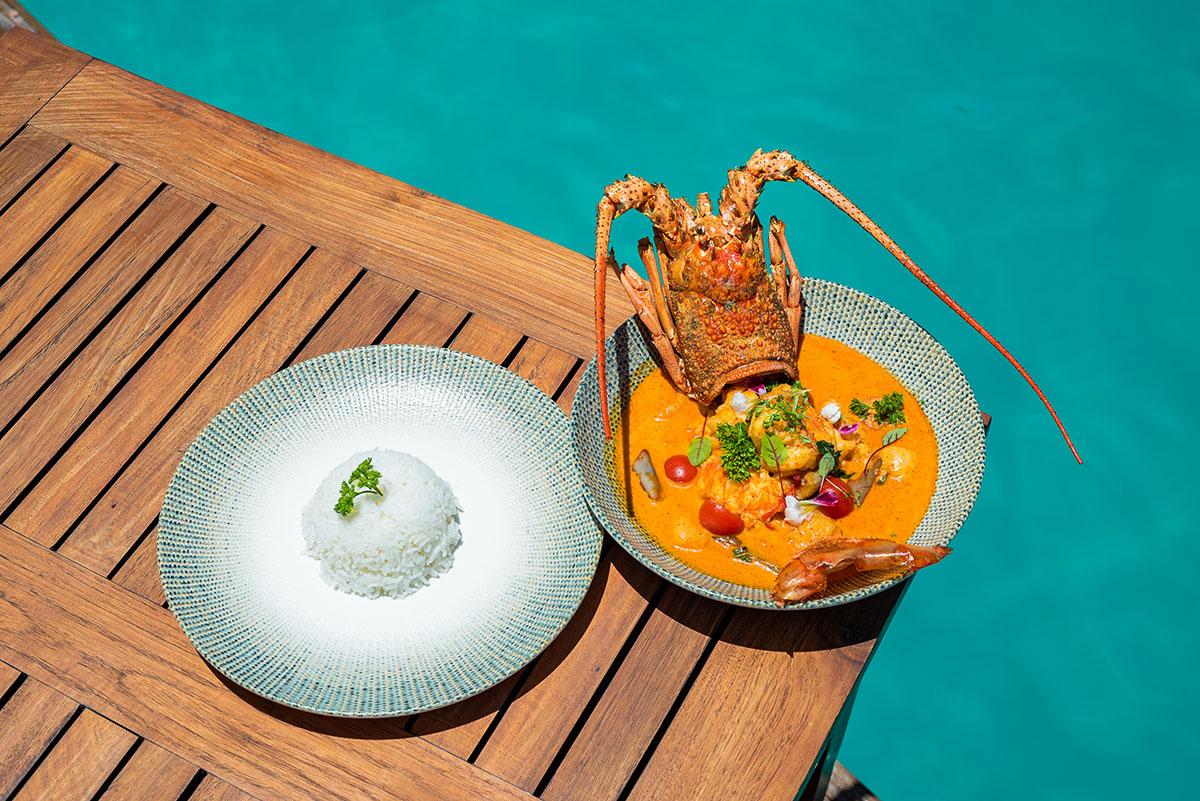 Delectable lobster curry simmered in aromatic spices at Funa, Angsana Velavaru's Pan-Asian restaurant. 
