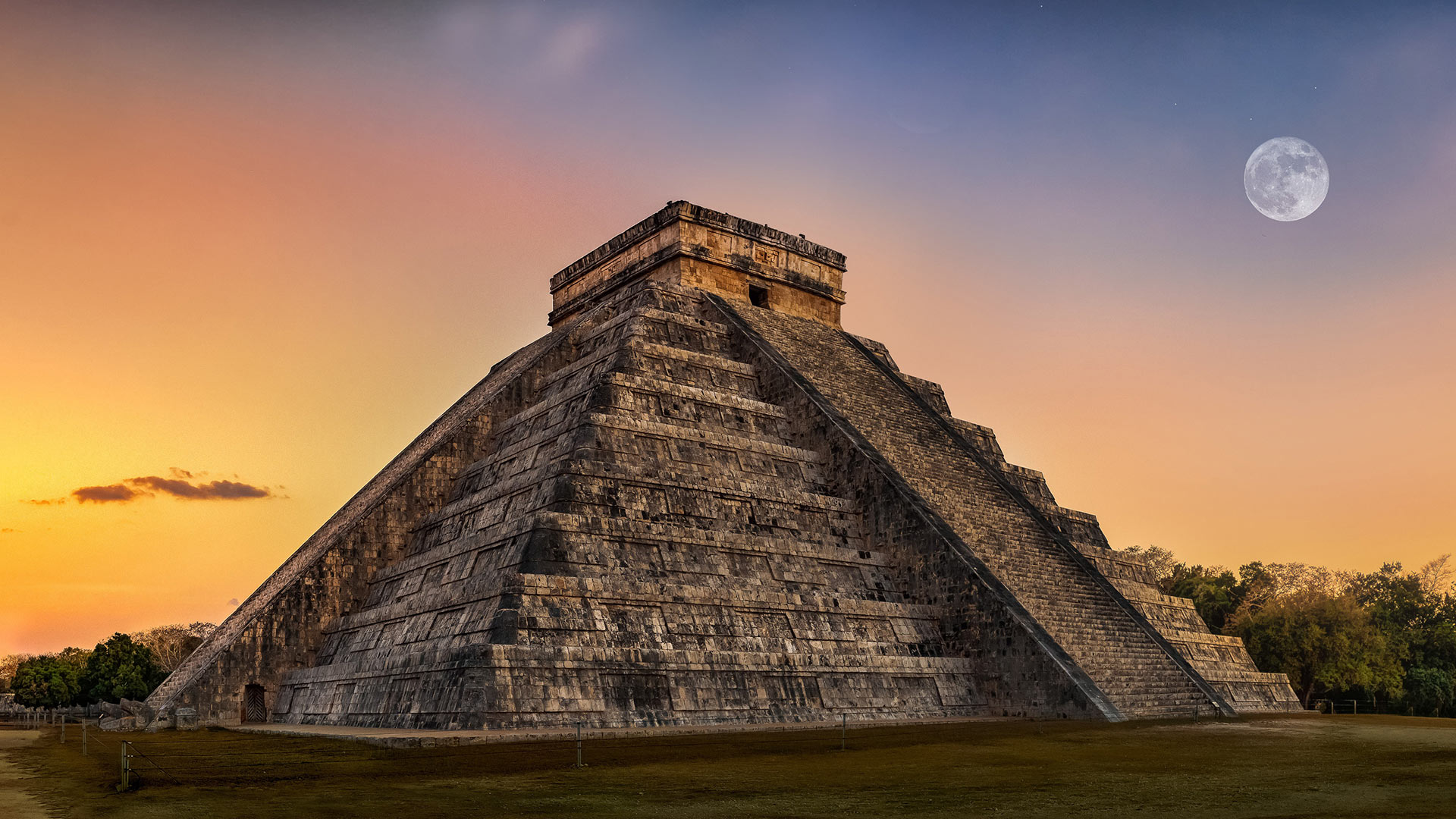 Ancient pyramid stands at sunset with full moon, enhancing Hacienda Xcanatun, Angsana Heritage Collection.