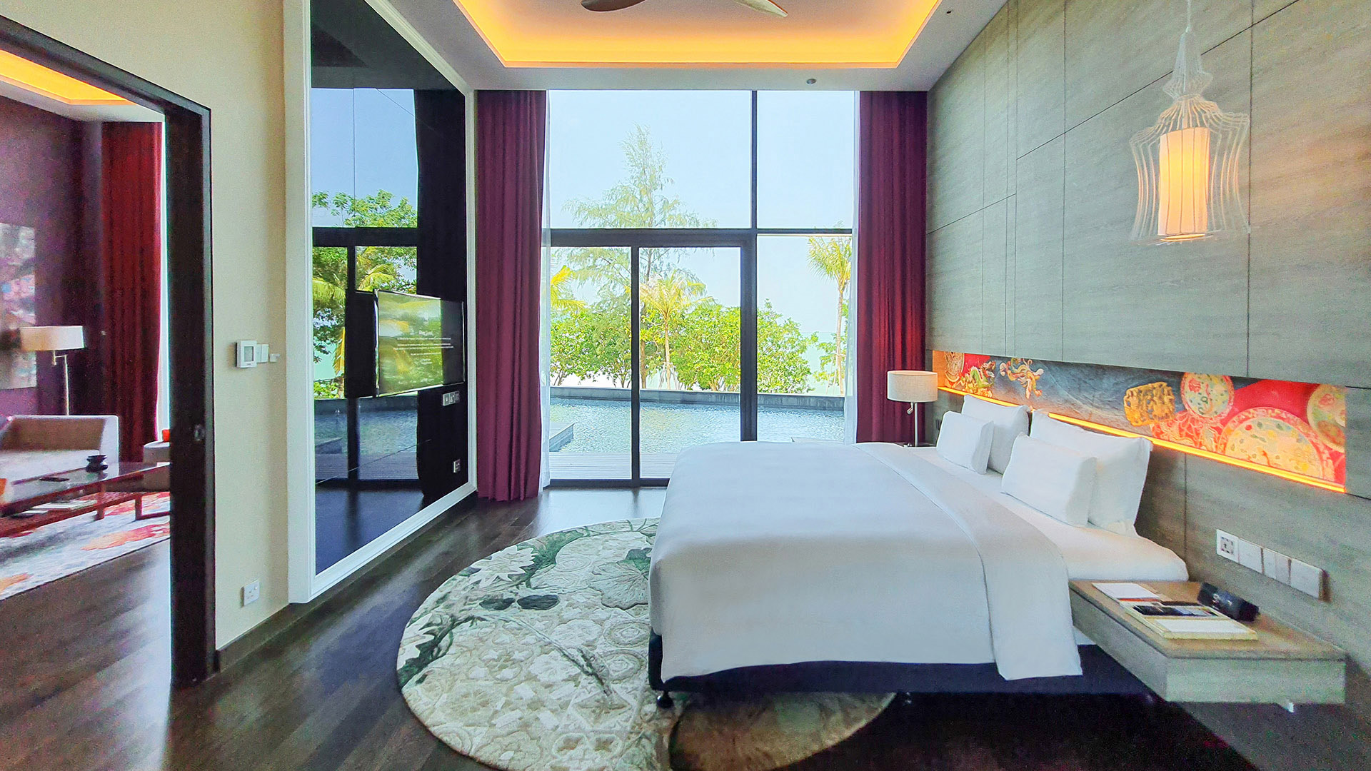 Luxurious bedroom with a pool view and modern decor at Angsana Teluk Bahang Penang.