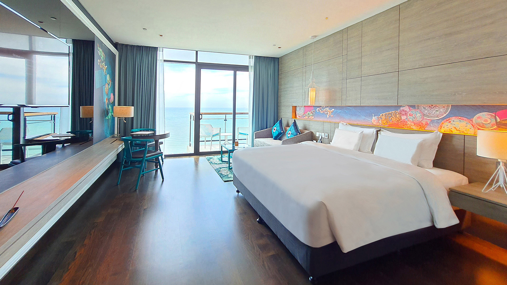 A bedroom with the oceanview and a private balcony at Angsana Teluk Bahang Penang.