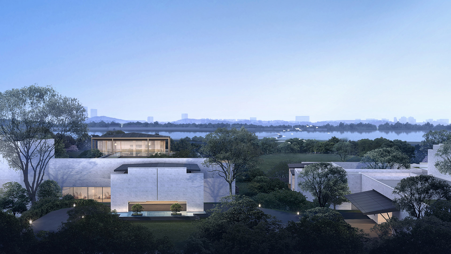 Angsana Quzhou China buildings overlook a serene lake, surrounded by lush greenery at dusk.