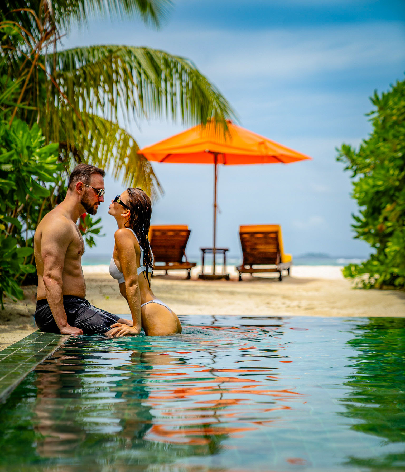 Couple in pool at Angsana Velavaru