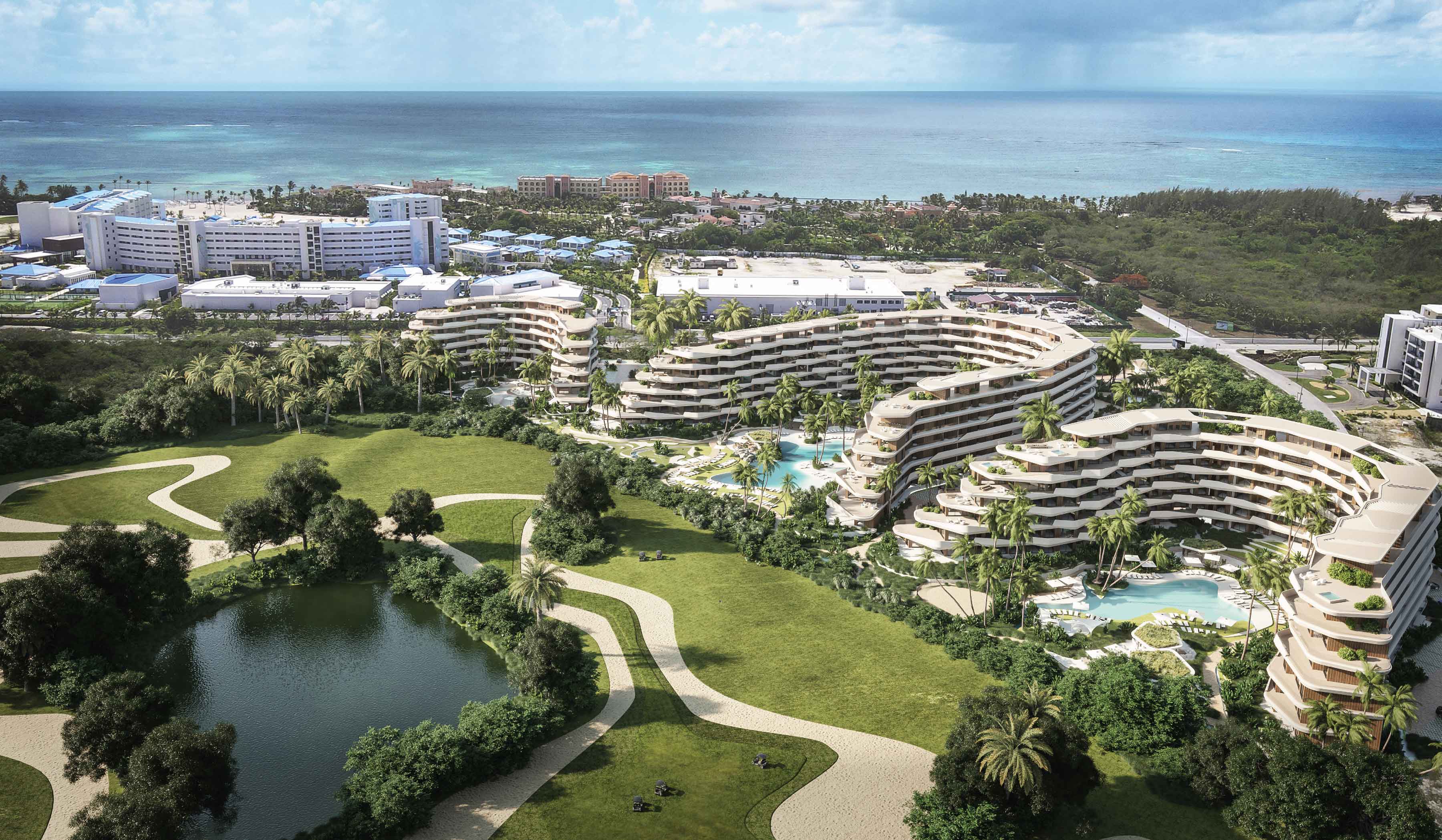 Aerial view of Angsana Cap Cana luxury resort architecture, lush gardens and Caribbean ocean background